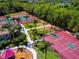 Overhead view of recreation area, including tennis courts, basketball court, and playground at 12841 Balsam Ter, Bradenton, FL 34212