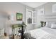 Bedroom featuring a desk area, window with shutters, and decorative oars on the wall at 1294 Riverscape St # D, Bradenton, FL 34208