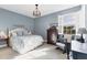 Comfortable bedroom featuring a ceiling fan, water view, and rocking chair at 1294 Riverscape St # D, Bradenton, FL 34208