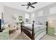 Cozy bedroom featuring a ceiling fan, desk area, and window with shutters at 1294 Riverscape St # D, Bradenton, FL 34208
