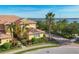 Inviting two-story home with brick driveway and manicured landscaping, showcasing tropical curb appeal at 1294 Riverscape St # D, Bradenton, FL 34208