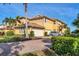 Lovely two-story residence with a multi-car garage, brick driveway, and tropical landscaping at 1294 Riverscape St # D, Bradenton, FL 34208