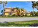 Charming two-story residence with lush landscaping and well-maintained lawn, enhancing its curb appeal at 1294 Riverscape St # D, Bradenton, FL 34208