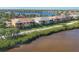 Beautiful waterfront home with screened lanai, lush landscaping, and serene canal views at 1294 Riverscape St # D, Bradenton, FL 34208