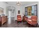 Inviting foyer with hardwood floors, shiplap walls, columns, and comfortable seating area at 1294 Riverscape St # D, Bradenton, FL 34208