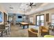 A comfortable game room featuring a pool table, seating and a television at 1294 Riverscape St # D, Bradenton, FL 34208
