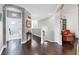Hallway with hardwood floors, and arched brick entryway at 1294 Riverscape St # D, Bradenton, FL 34208
