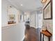 Hallway with hardwood floors and designer decor leading to several rooms at 1294 Riverscape St # D, Bradenton, FL 34208