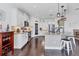 This kitchen features stainless appliances, granite counters, wooden floors and white cabinets at 1294 Riverscape St # D, Bradenton, FL 34208
