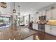 Open kitchen with stainless steel appliances, granite countertops and adjacent dining area at 1294 Riverscape St # D, Bradenton, FL 34208