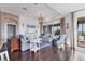 Bright living room features a decorative brick wall, nautical decor, and beautiful water views at 1294 Riverscape St # D, Bradenton, FL 34208