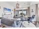 Bright living room features shiplap walls, nautical decor, and views of the water at 1294 Riverscape St # D, Bradenton, FL 34208