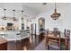 Open-concept living space includes kitchen, dining, and living areas, featuring modern finishes and wood floors at 1294 Riverscape St # D, Bradenton, FL 34208