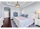 Comfortable main bedroom featuring a tray ceiling and decorative lighting at 1294 Riverscape St # D, Bradenton, FL 34208