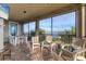 Covered screened-in patio with water views, multiple seating areas, string lights and brick flooring at 1294 Riverscape St # D, Bradenton, FL 34208