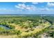 Expansive community featuring lush greenery and large lots offering privacy and a serene setting at 1668 Tropicaire Blvd, North Port, FL 34286