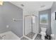 Updated bathroom featuring stand-up shower with glass doors and modern fixtures at 1668 Tropicaire Blvd, North Port, FL 34286