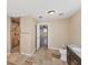 Bright bathroom featuring tiled floors, stand-up shower, and updated fixtures at 1668 Tropicaire Blvd, North Port, FL 34286