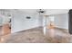 Open bedroom featuring neutral tile floors and access to an ensuite bath and outdoor patio at 1668 Tropicaire Blvd, North Port, FL 34286