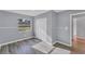 Light filled bedroom featuring wood floors, a ceiling fan, and closet space at 1668 Tropicaire Blvd, North Port, FL 34286