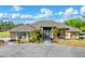 Spacious ranch home boasts tropical landscaping, a circular drive, and gated entry for enhanced privacy at 1668 Tropicaire Blvd, North Port, FL 34286