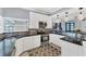 Contemporary kitchen with stainless steel appliances, modern cabinetry, and ample counter space at 1668 Tropicaire Blvd, North Port, FL 34286