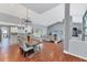 Spacious open-concept living and dining area leading to a pool via sliding glass doors at 1668 Tropicaire Blvd, North Port, FL 34286