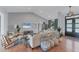 Spacious living room with high ceilings, comfortable seating, and modern decor at 1668 Tropicaire Blvd, North Port, FL 34286