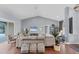 Open-concept living room featuring vaulted ceilings, comfortable seating, and stylish accents at 1668 Tropicaire Blvd, North Port, FL 34286