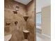 Tiled shower featuring multiple shower heads and built-in shelving at 1668 Tropicaire Blvd, North Port, FL 34286