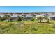 Aerial view of homes with screened pools and well-maintained lawns in a community at 17675 Azul Dr, Lakewood Ranch, FL 34202
