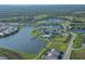 Aerial view of the community, featuring scenic ponds, lush landscaping, and resort-style amenities at 17675 Azul Dr, Lakewood Ranch, FL 34202