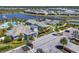 Aerial view of the community center with pool, tennis courts, and ample parking at 17675 Azul Dr, Lakewood Ranch, FL 34202
