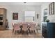 Open dining room with modern chandelier, dining table seating, and modern decor at 17675 Azul Dr, Lakewood Ranch, FL 34202