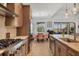 Modern kitchen with stainless steel appliances, island sink, and view to the outdoor dining area at 17675 Azul Dr, Lakewood Ranch, FL 34202