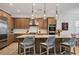 Spacious kitchen with a center island, pendant lighting, stainless steel appliances, and bar stool seating at 17675 Azul Dr, Lakewood Ranch, FL 34202