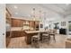Modern kitchen featuring a center island with seating, stainless steel appliances, and custom cabinetry at 17675 Azul Dr, Lakewood Ranch, FL 34202
