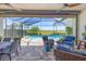 Inviting lanai seating area with pool view, perfect for outdoor relaxation and dining at 17675 Azul Dr, Lakewood Ranch, FL 34202