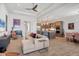Open-concept living room flows into modern kitchen with stainless appliances and features a comfortable seating area at 17675 Azul Dr, Lakewood Ranch, FL 34202