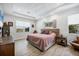 Comfortable main bedroom with ample natural light, ceiling fan and modern decor at 17675 Azul Dr, Lakewood Ranch, FL 34202