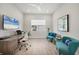 Comfortable home office with a desk, seating area, and bright natural light at 17675 Azul Dr, Lakewood Ranch, FL 34202