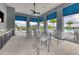 Outdoor patio area with comfortable seating overlooking the pool and lake views at 17675 Azul Dr, Lakewood Ranch, FL 34202