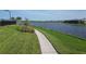 Scenic view of a tranquil pond surrounded by lush greenery, offering a peaceful escape at 17675 Azul Dr, Lakewood Ranch, FL 34202