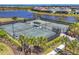 Aerial view of tennis courts surrounded by lush landscaping in a well-maintained community at 17675 Azul Dr, Lakewood Ranch, FL 34202