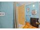 Bathroom featuring aqua walls, decorative shower curtain, and a single-sink vanity for a calming space at 2110 Euclid Ter, Sarasota, FL 34239