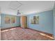 Bright bedroom with two large windows and tile floors offering views of the property at 2110 Euclid Ter, Sarasota, FL 34239