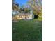 Exterior view of home with yard and surrounding trees at 2110 Euclid Ter, Sarasota, FL 34239