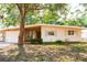 Charming single-story home with stone accents and a well-maintained front yard at 2110 Euclid Ter, Sarasota, FL 34239