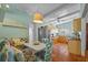 Eat-in kitchen with tile floors, seating, and wood cabinetry at 2110 Euclid Ter, Sarasota, FL 34239