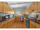 Kitchen with wood cabinetry and stainless steel appliances at 2110 Euclid Ter, Sarasota, FL 34239